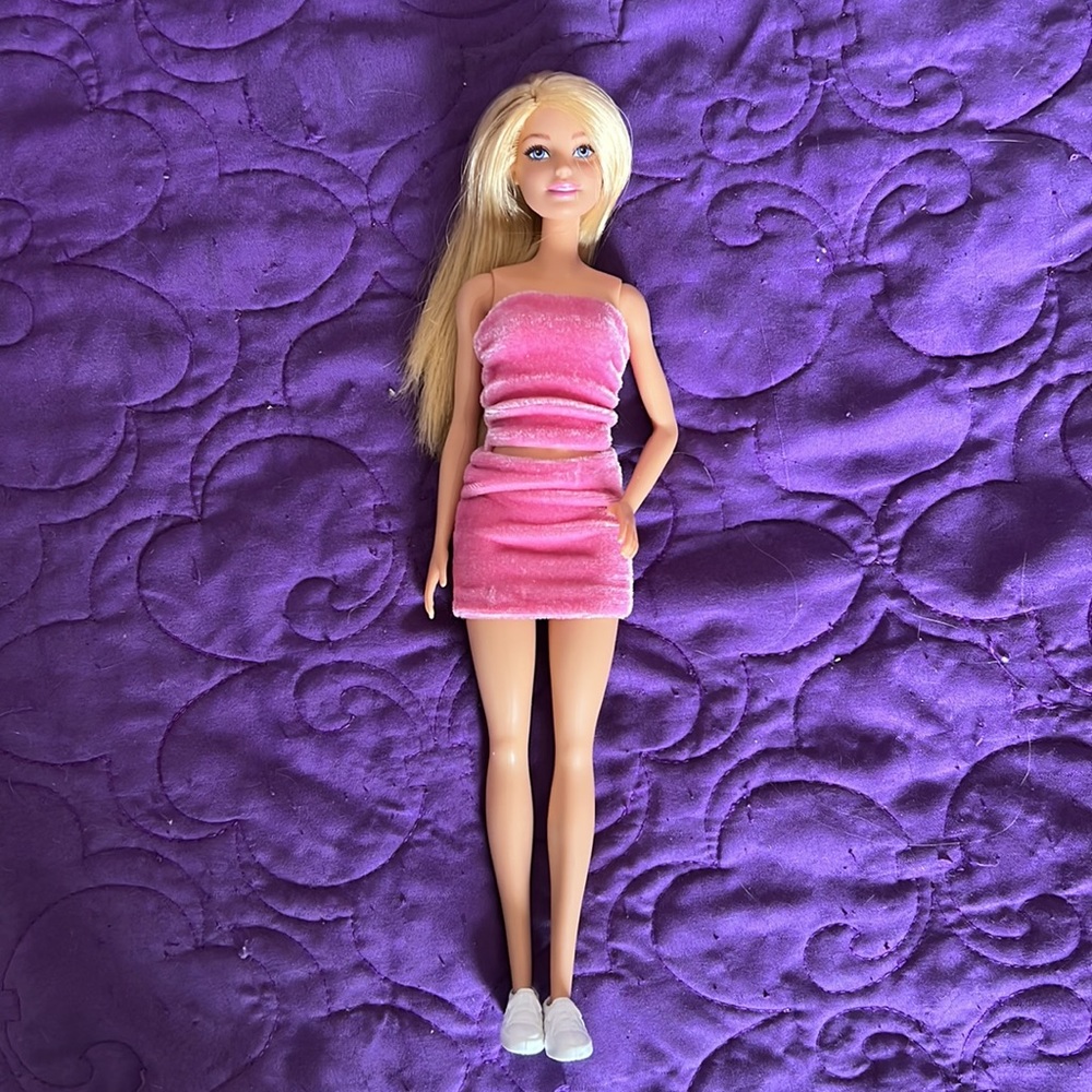 Barbie doll in pink velour set